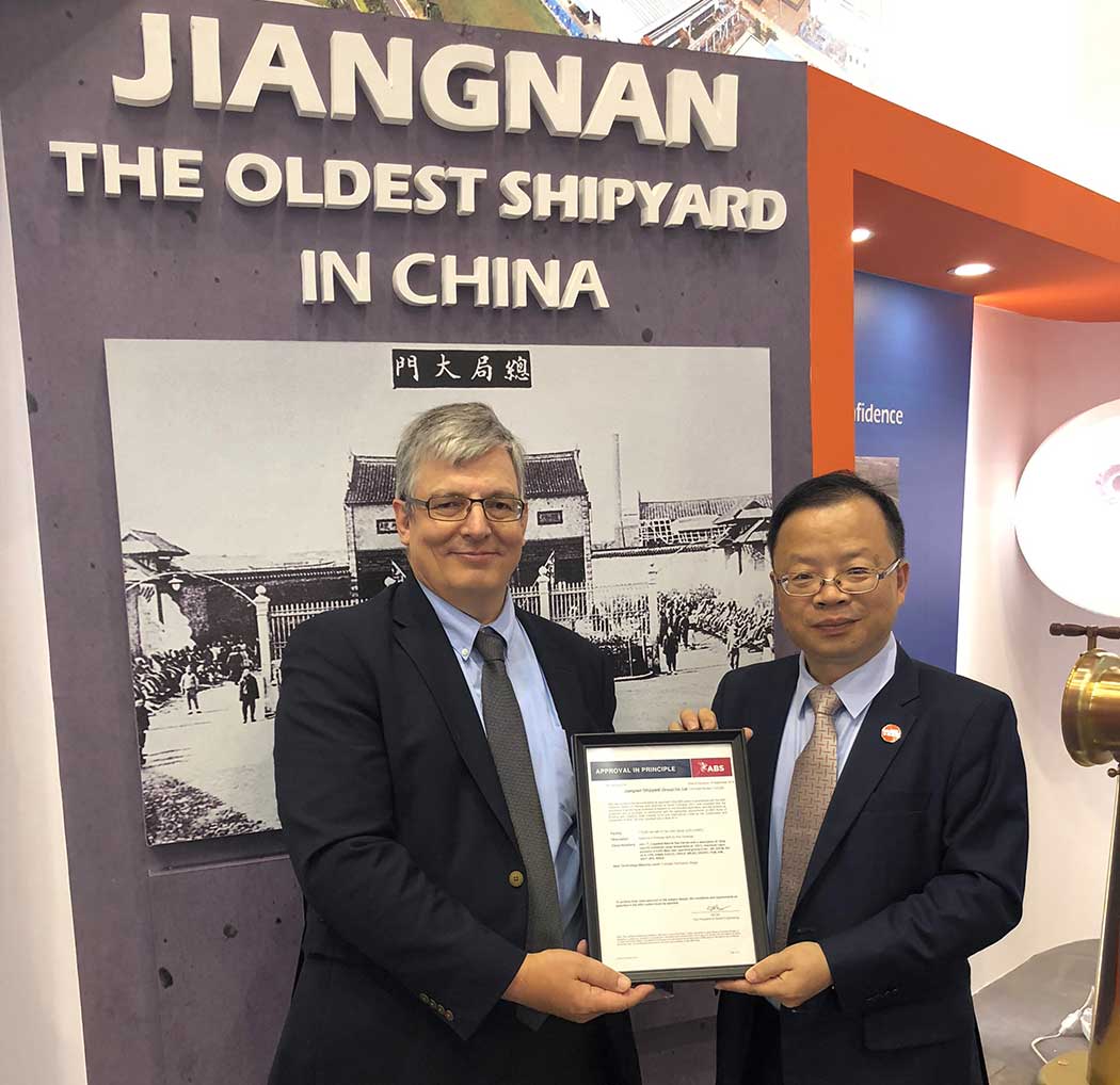 Hu Keyi, Technical Director of Jiangnan Shipyard (Group) Co. Ltd receives the AIP from Patrick Janssens, ABS Vice President, Global Gas Solutions