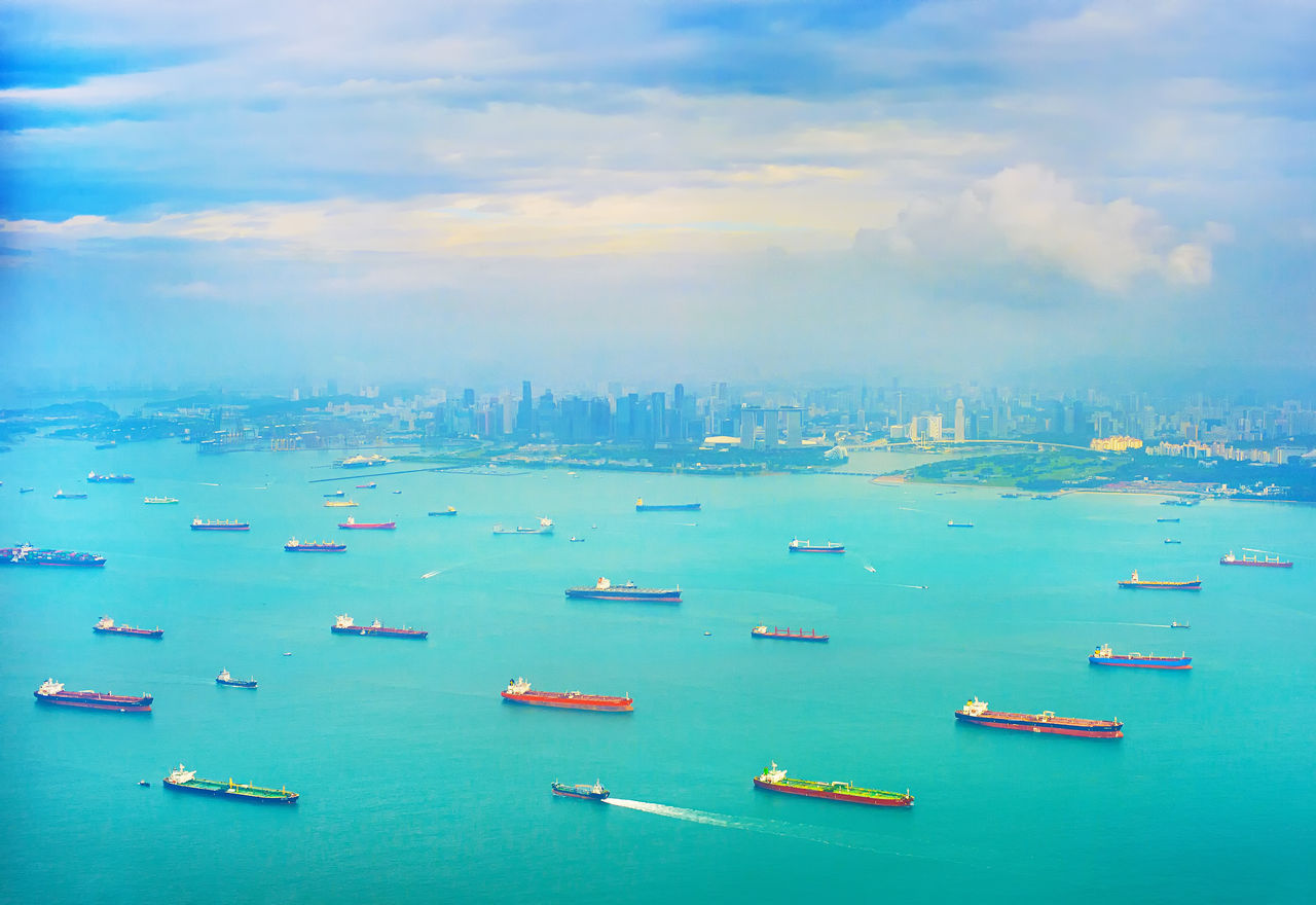 Cargo tanker ships in Singapore harbor. Singapore Downtown in the background; Shutterstock ID 765469201; purchase_order: -; job: -; client: -; other: -